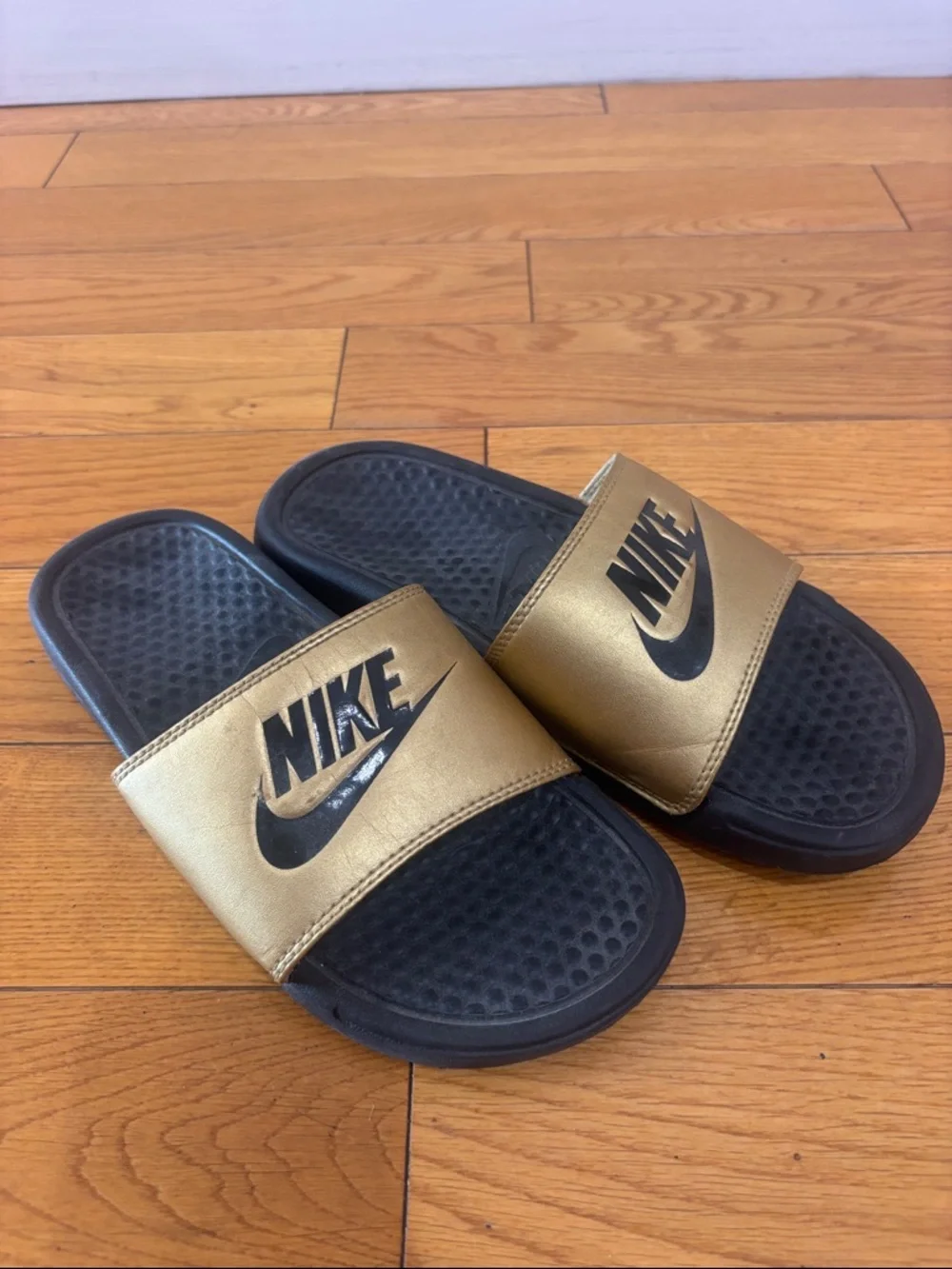 Nike Black and Gold Slide Sandals, women’s size 6